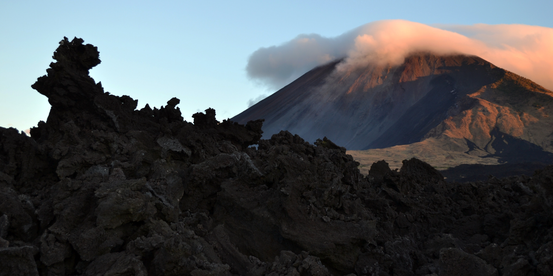 The **Pacaya Volcano** is located in Escuintla, Guatemala. It is considered a national park and thanks to its constant eruptions throughout history, its height has changed, although 2,500 meters above sea level have been recorded.

It erupted for the first time approximately 25,000 years ago and, after almost a century of inactivity, it was reactivated in 1996. Hundreds of locals and tourists climb the Pacaya Volcano every year, here are 6 tips to climb it in the best way:

---

## Recommendations for climbing the Pacaya Volcano

The ascent is considered short, in fact, a person who does little or no exercise the estimated time is 1 hour and 45 minutes, for the descent it is estimated that it takes about 1 hour.

![blog-escalar-volcan-pacaya-guatemala-introduccion.png](https://cdn.travelisimo.com/blog_escalar_volcan_pacaya_guatemala_introduccion_0499ab7510)
##### Photograph of lava in the Pacaya Volcano with the sunset in the background

---

## Follow these 6 tips

This tourist attraction, located in the municipality of San Vicente Pacaya, represents a challenge, therefore, it is important to be prepared and adhere to the recommendations:

- **Hire the services of a local guide**: be adventurous, but with caution! Hiring the services of a local guide is essential in this type of expedition, especially if you do not know the area and the challenges it may present. 

- **Prepare yourself physically in advance**: preparing your physical condition before going to Pacaya Volcano is an excellent idea. Hiking, especially on inclines, can be very helpful. Remember that constancy is mainly important. 

- **Get appropriate clothing**: jeans or cotton clothes are not recommended. Keep in mind that the use of appropriate shoes for this type of experience (with cleats or hiking boots) can make the difference when it comes to avoiding injuries.

###### Use the code **PACAYAVOLCANO** to obtain a 10% discount on the purchase of tours to the Pacaya Volcano with [**Travelisimo**](https://travelisimo.com)

- **Carry a first aid kit**: band-Aids, [Advil®](https://www.advil.com/es/nuestros-productos/advil-tabletas-advil/) and TYLENOL® are three medical products that cannot be missing in a first aid kit, it should not be too big, the key is that it contains the most important things.

- **Plan your meals and carry liquids for hydration**: canned food, breads, fruit and snacks such as candy, seeds or bars, are the most recommended foods. Also, don't forget to hydrate before, during and after [climbing the Pacaya Volcano](https://travelisimo.com/es/guatemala/actividades/tours-y-experiencias/guatemala-city/hike-the-pacaya-volcano-and-relax-in-hot-springs?country=GT&)

- **Return the garbage that you generate during the tour**: take a bag to put in it all the waste you generate while on the volcano. In addition to following the rules of the community, it is important to contribute to the cleanliness of this tourist attraction that is important for Guatemalans.

![blog-escalar-volcan-pacaya-guatemala-información.png](https://cdn.travelisimo.com/blog_escalar_volcan_pacaya_guatemala_informacion_137a9d4f41)
##### Photography of Pacaya Volcano in daytime

---

## In Travelisimo we take you to the Pacaya Volcano

Now you know, if you go to this or any other volcano, you should wear the right clothes, bring a first-aid kit, plan your meals and drinks, and return the garbage you generate to contribute to the environment and the community you visit.

Climb the Pacaya Volcano soon, and book the *tour* at [**Travelisimo**](https://travelisimo.com), we have everything you need to make your adventure a spectacular experience.