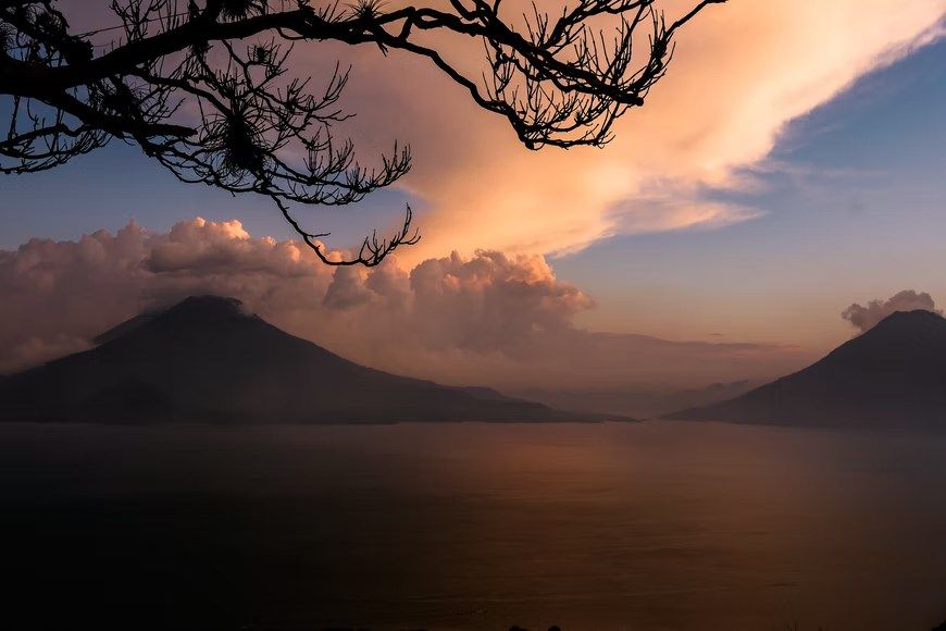 ## Language
Spanish is the official language in Guatemala and is spoken by 93% of the population. There are also 21 Mayan tongues officially recognized as languages in the country.

![10.png](https://cdn.travelisimo.com/10_ba0654fe93)

## Weather
Guatemala has a warm climate all year, temperatures peak at an average of 22 to 32 degrees in April and May. Despite this high temperature, you won’t suffer hot weather, because humidity levels are determined by altitude, and many locations have low humidity including Antigua, Guatemala City and Lake Atitlan.

![9.png](https://cdn.travelisimo.com/9_3da0a88764)

Guatemala has a rainy season, which runs from May to October, with the worst of the rain falling in September and October. The best time to visit Guatemala in terms of weather is between December to August, in terms of anything else, all year long!

## Cuisine
Most traditional foods are based on Mayan Cuisine with Spanish influence. Guatemalan food is made with corn, pepper, hot peppers, and beans as main ingredients. Many dishes are prepared without cooking oil, usually, the ingredients are placed on the comal or wrapped in plantain leaves. Some of the most popular and tasty dishes to try are:

- Kak’ik
- Pepian
- Jocon

Although desserts are terrific to try if what you are into is something sweet, you can start trying:

- Rellenitos
- Buñuelos
- Canillitas de leche

![11.png](https://cdn.travelisimo.com/11_7b44ea7eca)

## Time
Guatemala is on the equivalent of Central Standard Time in North America, six hours behind GMT. There is not much seasonal change, it gets sunlight around 6 am and sunset around 5:30 pm in December or 6:30 pm during June.

## Internet
Web services are well established in Guatemala. Wi-fi is very common in all the main tourist centers, most hotels, hostels, restaurants, and cafes. Connection speed is usually fairly swift in the urban areas but could be less potent in rural areas or towns.

## Laundry
Almost every town has at least one laundry; most of them wash and dry a pound around $3 to $4 USD. Self-service laundries are not common. Hotels and hostals also offer laundry facilities; the low budget places often have a pila (sink) where you can wash your own clothes.

## Holidays
Guatemala has important holidays for 11 months, either due to history or to relevant historical facts. From January to December, the only month without holidays is July. Although in Antigua and some other places, they celebrate (town holiday) on July 25th.
