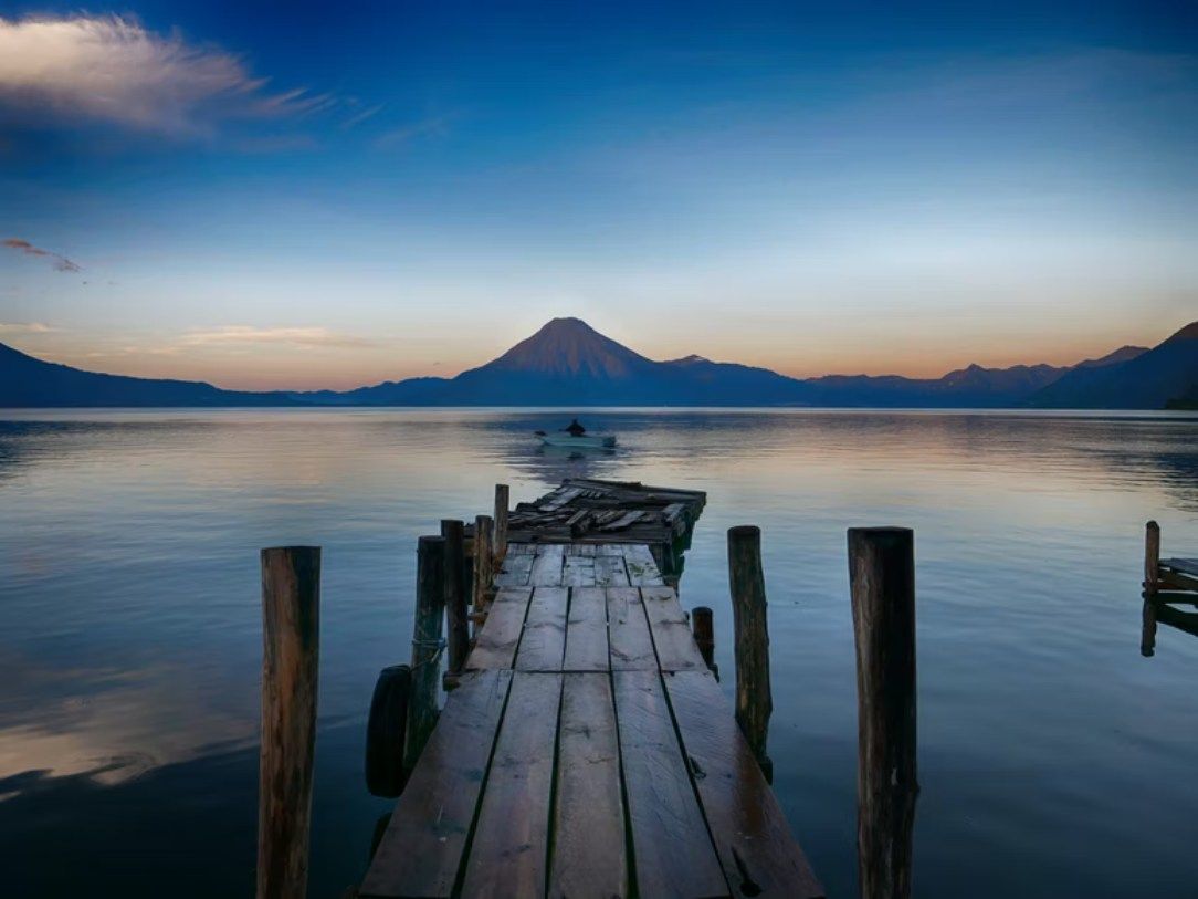 The most diverse Central America’s country attracts travelers with its extraordinary landscapes and culture that reaches back centuries. Guatemala is commonly known as the Eternal Spring Country and home of the Maya. It's known for its colonial architecture, volcanoes, ruins, wildlife, handcrafts, natural beauties and textiles.

## History

This country was conquered by Spain in 1524 and became independent in 1821. The Spanish left behind plenty of footprints from their colonial conquest of Guatemala, being the most visible the frequently stunning architecture in our beautiful La Antigua Guatemala... 

The old capital, its neat plazas, and monumental ruins. From the grandiose coffee-boom buildings of Quetzaltenango to Guatemala City’s stately cathedral, to the churches and municipal buildings clustering around central squares in even the smallest towns, Guatemala bears the marks of its European encounters in vivid bricks and tiles.

![1.jpg](https://cdn.travelisimo.com/1_818396a95d)

## Custom

- **Holy Week:** Lent (starting at Ash Wednesday) is a big deal in the colonial city of La Antigua Guatemala, where religious processions wind their way through town during the season to finish on Easter Sunday. This celebration draw thousands of visitors from around the world to see sawdust carpets and religious processions. You will need to book accommodation in advance if you want to live and see this tradition.

![2.jpg](https://cdn.travelisimo.com/2_91456f38ce)

- **Giant Kites Festival:** This tradition celebrated for All Saint’s day honors the dead with huge kites that are constructed in Sumpango and Santiago Sacatepequez. Visit these two villages to see massive kites decorated in bright colors, often with political and pro-nature messages. Both places are within 30 minutes of Antigua Guatemala.

![3.jpg](https://cdn.travelisimo.com/3_89eb1b9579)

- **The Burning Bull - Torito:** The burning of the bull is part of the traditions of the culture of several towns in Guatemala and is celebrated several times throughout the year. This bull is handmade with colored paper and is wrapped in fireworks. The torito is usually burned in front of churches, and inside the torito there is a person who dances while the fireworks are lit. This tradition originated after the Spanish conquest to celebrate the arrival of pyrotechnics to the country.

![4.jpg](https://cdn.travelisimo.com/4_bbc39bac6b)
 
- **Dance of the Moors:** This joyful tradition is carried out in different towns of the country including Guatemala City. The dance of Moors and Christians tells the story of the battle between the Moors and Christians in Spain. The striking thing about the dance is in the dancer garments to represent the characters. You will recognize Spanish Christians by their bearded masks and flashy clothing. Instead, the Moors have dark masks, turbans, and cloth covering their faces.

![5.jpg](https://cdn.travelisimo.com/5_05e80663db)

- **Fiambre:** Every year Guatemalan families prepare and eat the traditional cold meat salad to eat on the Day of the Dead and All Saints Day. The huge salad can be made with as many as 50 ingredients, but the most important are sausages, cold cuts, pickled baby corn and beets.  

![6.jpg](https://cdn.travelisimo.com/6_a39ef1e404)
 
- **Posadas:** Before Christmas, if you are in Guatemala, you will be able to witness different processions followed by families and friends while they sing Christmas carols and local songs, from december 15th to the 23rd at 7:00pm. The purpose of processions is to request posada (accommodation) in different houses where they eat tamales and ponche (hot fruit beverage) until midnight. 

![7.jpg](https://cdn.travelisimo.com/7_6ce14d8684)